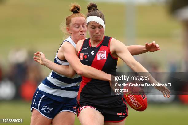 Aishling Moloney of the Cats tackles Danielle Marshall of the Bombers during the round six AFLW match between Essendon Bombers and Geelong Cats at...