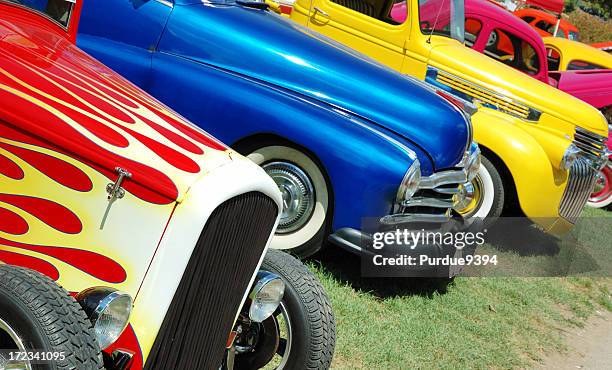 line of hotrod cars in grass at car show - bilutställning bildbanksfoton och bilder