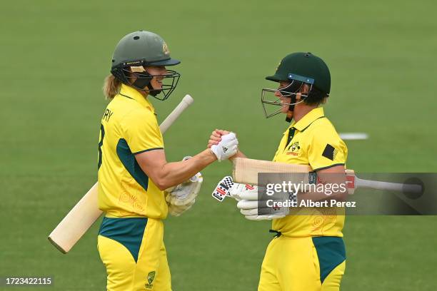 Ellyse Perry and Beth Mooney of Australia celebrate victory during game one of the One Day International series between Australia and the West Indies...