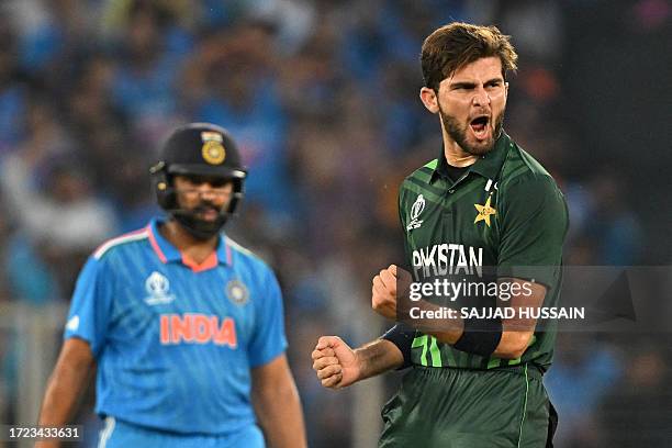 Pakistan's Shaheen Shah Afridi celebrates after taking the wicket of India's Shubman Gill as India's captain Rohit Sharma watches during the 2023 ICC...