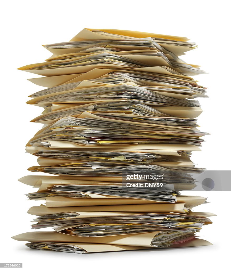 Stack of file folders on white background