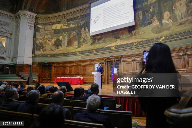 The audience listens to France's Education and Youth Minister Gabriel Attal delivering a speech at the Sorbonne university in Paris on October 14...