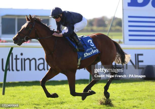 City Of Troy and Ryan Moore coming home to win the Native Trail's Dewhurst Stakes on day two of the Dubai Future Champions Festival at Newmarket...