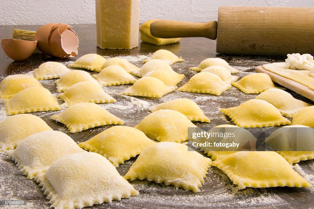 Close-up of homemade ravioli surrounded with ingredients