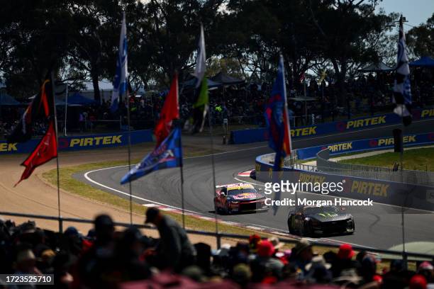Jamie Whincup drives the Triple Eight Race Engineering Chevrolet Camaro and James Moffat drives the Tickford Racing Ford Mustang during the Bathurst...