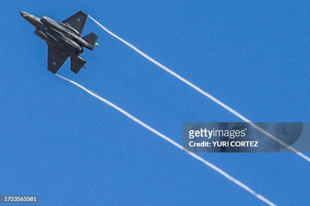 An Israeli Air Force F-35I Adir multirole fighter aircraft flies over the Negev Desert after taking off from a military base en route to the Gaza...