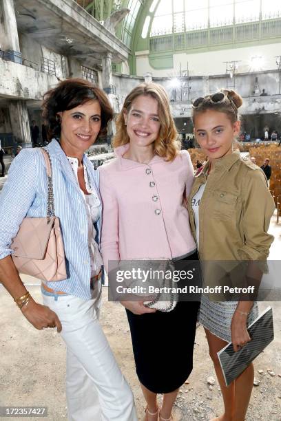 Natalia Vodianova stands between Ines de La Fressange and her daughter Violette d'Urso attend the Chanel show as part of Paris Fashion Week...