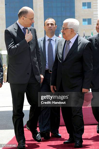 In this handout photo provided by PPO, President Mahmoud Abbas meets with Italian Prime Minister, Enrico Letta on July 2, 2013 in Ramallah, West...