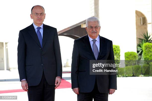 In this handout photo provided by PPO, President Mahmoud Abbas meets with Italian Prime Minister, Enrico Letta on July 2, 2013 in Ramallah, West...