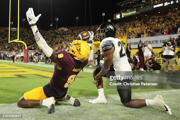 Wide receiver Troy Omeire of the Arizona State Sun Devils reacts after catching a 15-yard touchdown reception against cornerback Carter Stoutmire of...