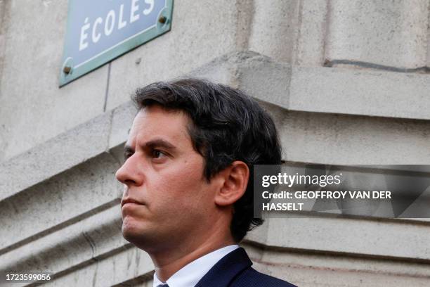 France's Education and Youth Minister Gabriel Attal waits for the arrival of French Prime Minister at the Sorbonne university in Paris on October 14...