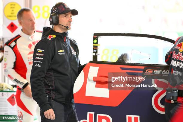 Jamie Whincup reacts after the Triple Eight Race Engineering Chevrolet Camaro driven by Broc Feeney pulled into the garage due to mechanical issues...