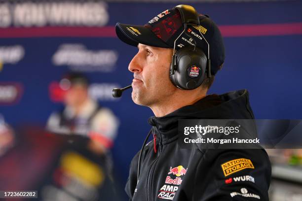 Jamie Whincup reacts after the Triple Eight Race Engineering Chevrolet Camaro driven by Broc Feeney pulled into the garage due to mechanical issues...