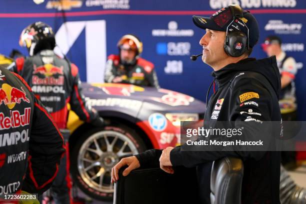 Jamie Whincup reacts after the Triple Eight Race Engineering Chevrolet Camaro driven by Broc Feeney pulled into the garage due to mechanical issues...