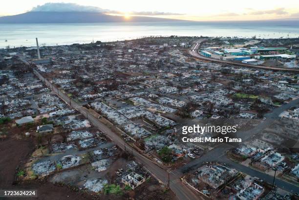 In an aerial view, burned structures and cars are seen nearly two months after a devastating wildfire on October 07, 2023 in Lahaina, Hawaii. The...
