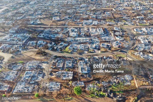 In an aerial view, burned homes and cars are seen nearly two months after a devastating wildfire on October 07, 2023 in Lahaina, Hawaii. The...