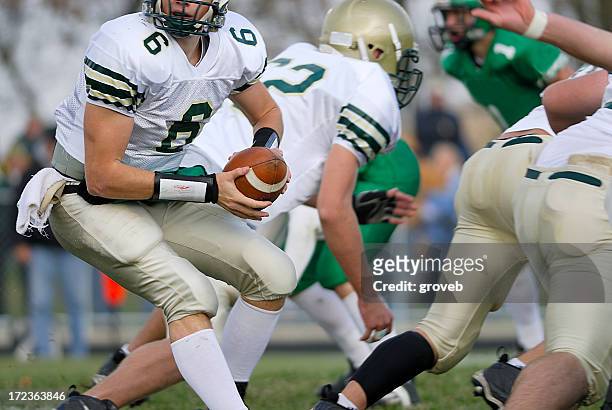 american football, quarterback - quarterback stock pictures, royalty-free photos & images