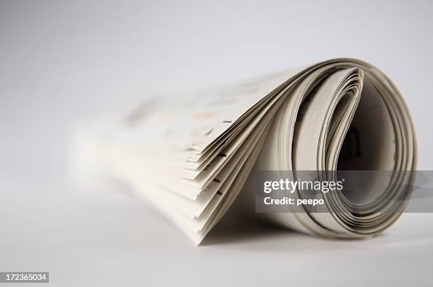 newspaper series - rolled newspaper stock pictures, royalty-free photos & images