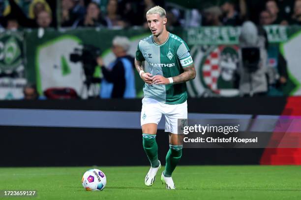 Marco Friedl of Werder Bremen runs with the ball during the Bundesliga match between SV Werder Bremen and TSG Hoffenheim at Wohninvest Weserstadion...