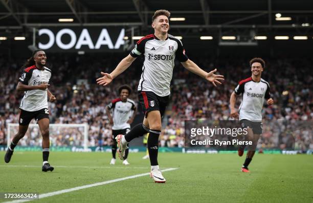 Tom Cairney of Fulham celebrates after scoring his teams second goal during the Premier League match between Fulham FC and Sheffield United at Craven...