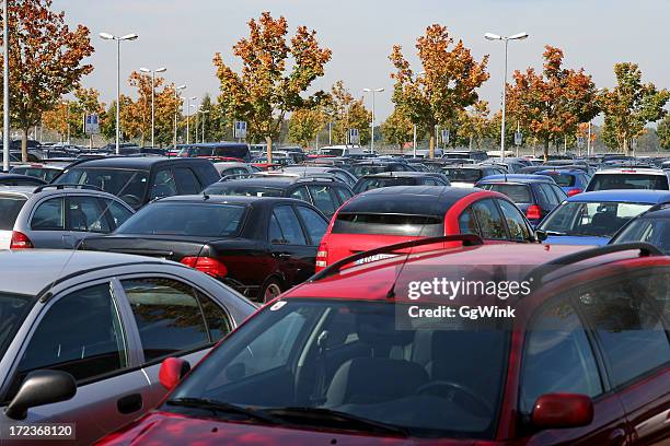 the tops of many rows of cars in a parking lot with trees - full stock pictures, royalty-free photos & images