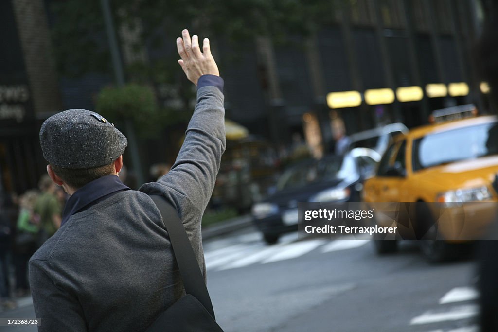 Man Hailing Cab From Street