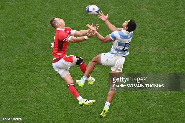Wales' full-back Liam Williams and Argentina's outside centre Lucio Cinti compete for the high ball during the France 2023 Rugby World Cup...