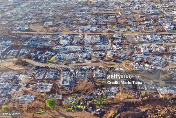 In an aerial view, burned homes and cars are seen nearly two months after a devastating wildfire on October 07, 2023 in Lahaina, Hawaii. The...