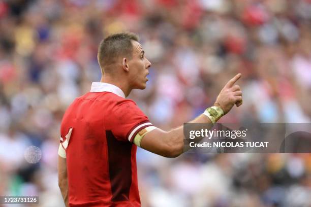 Wales' full-back Liam Williams gestures with the numbers partially fallen from his jersey during the France 2023 Rugby World Cup quarter-final match...