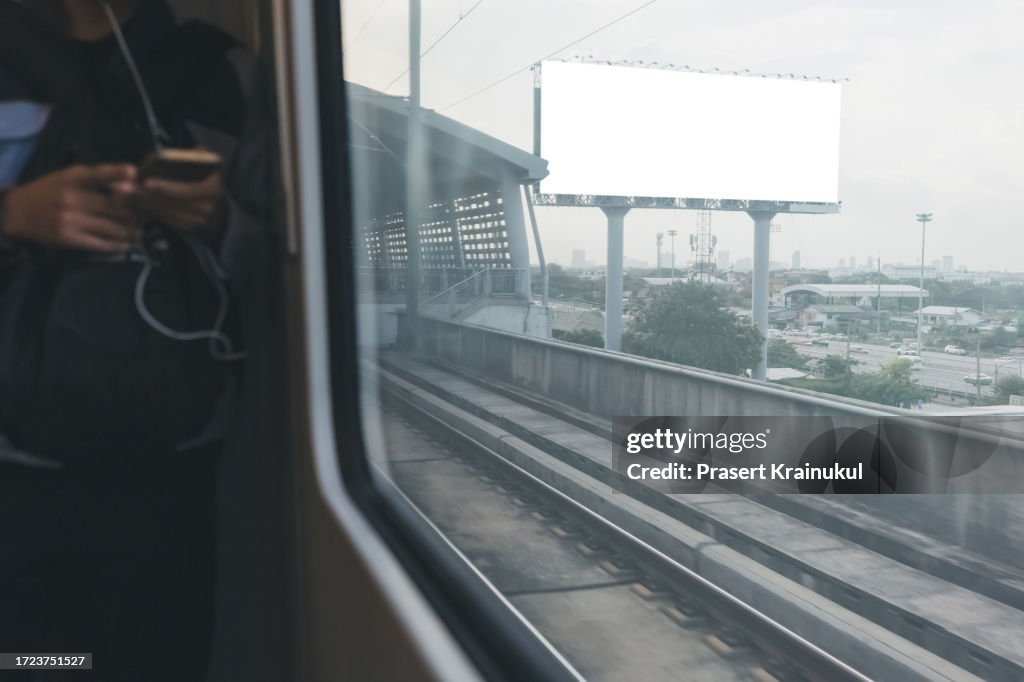 Sky train with white blank white billboard