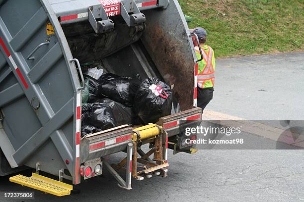 garbage truck - vuilnisman stockfoto's en -beelden