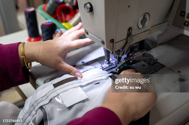 hands using sewing machine - tailor stock pictures, royalty-free photos & images