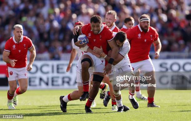 Taulupe Faletau of Wales is tackled by Mikheil Gachechiladze of Georgia during the Rugby World Cup France 2023 match between Wales and Georgia at...