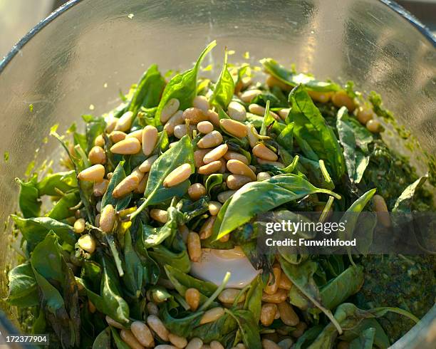 a bowl with pesto sauce and some italian food - pestosaus stockfoto's en -beelden