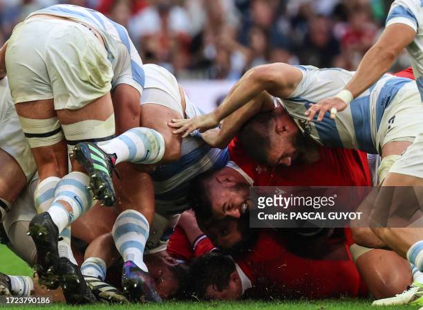 Wales' loosehead prop Gareth Thomas pushes as a scrum collapses during the France 2023 Rugby World Cup quarter-final match between Wales and...