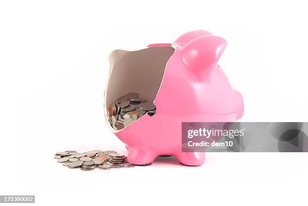 broken piggy bank with money spilling out - smashed piggy bank stock pictures, royalty-free photos & images
