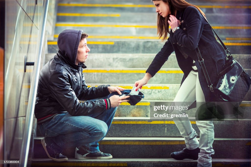 Young adult begging on the streets of Europe