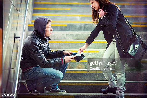 young adult begging on the streets of europe - beggar stock pictures, royalty-free photos & images