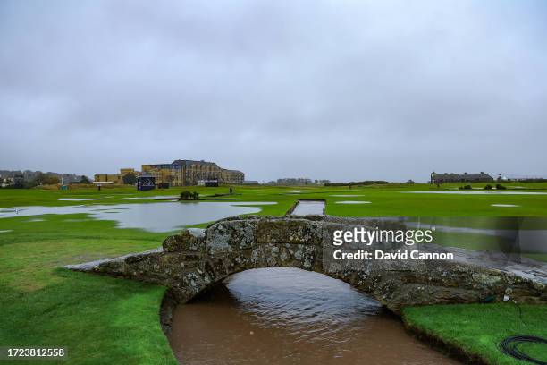View of the flooded course from the Swilcan Bridge looking towards the first green and The Old Course Hotel on The Old Course after play was...