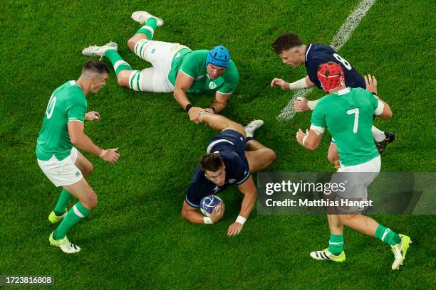 Richie Gray of Scotland is tackled by Garry Ringrose of Ireland during the Rugby World Cup France 2023 match between Ireland and Scotland at Stade de...