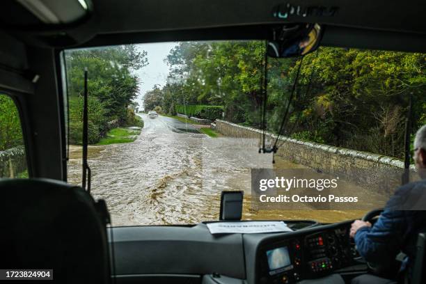 Vehicles attempt to maneuver through flooded roads between the Old Course St. Andrews and Kingsbarns Golf Links ahead of Round Three, during Day...