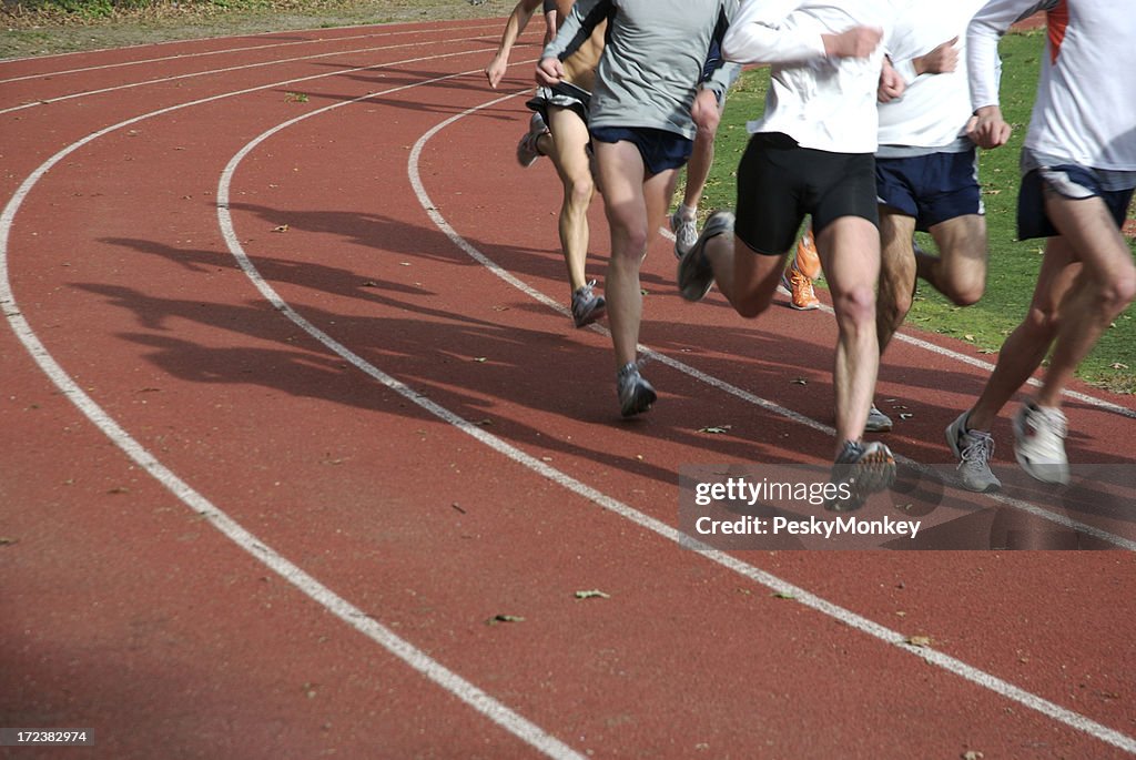 Athletes Running on Red Running Track