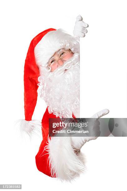 santa pointing around a white corner - gluren stockfoto's en -beelden