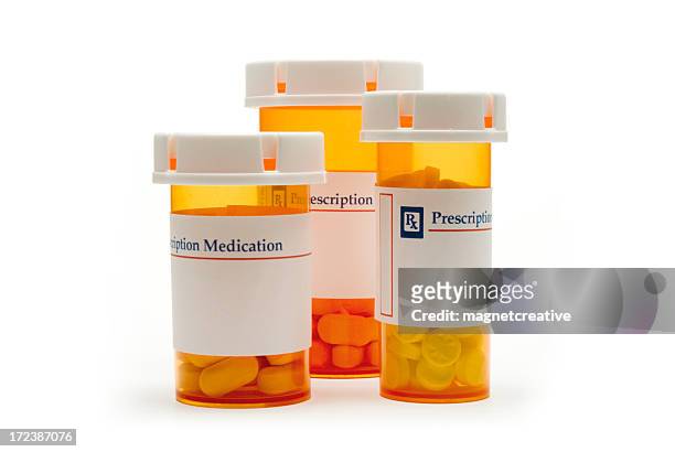 three prescription medicine bottles - rx stockfoto's en -beelden