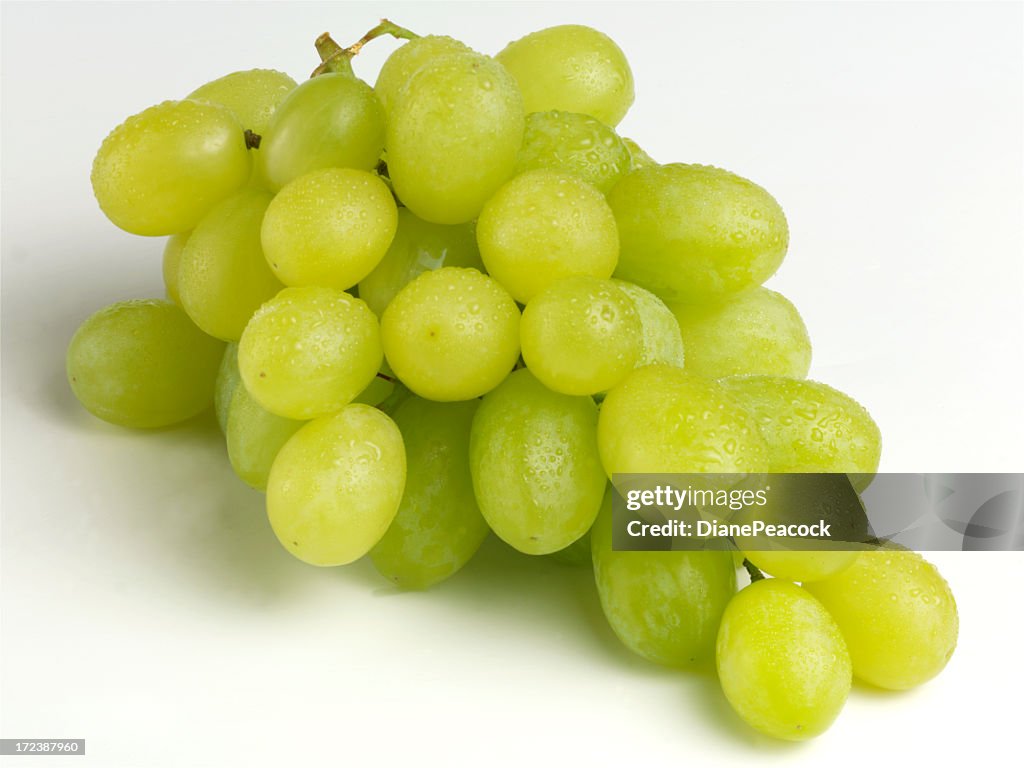 Bunch of ripe juicy green grapes off the vine