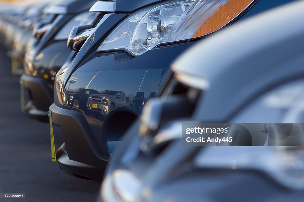 Close up of front bumpers of new cars