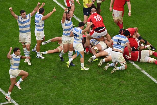 Argentina's players celebrate after scoring their first try during the France 2023 Rugby World Cup quarter-final match between Wales and Argentina at...