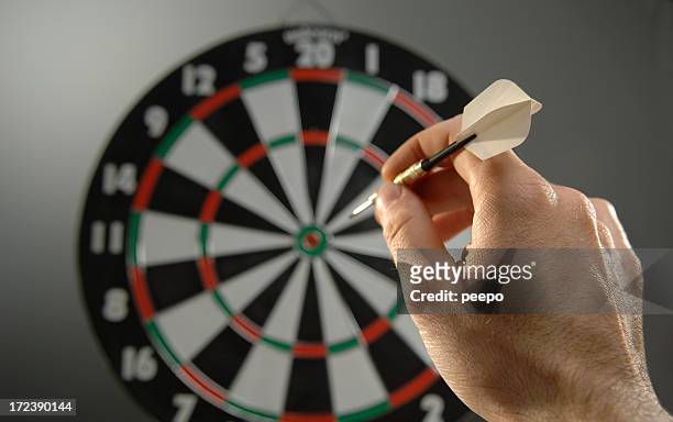 darts series - hand throwing stock pictures, royalty-free photos & images