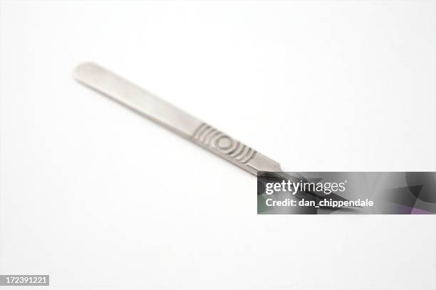 surgical scalpel (focus on blade) - scalpel stockfoto's en -beelden