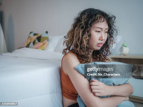 portrait of upset asian women feel strain or tired from mental health illness - sorry stock pictures, royalty-free photos & images